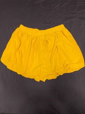 Yellow bubble shorts by AYIFU feature a high waist and a puffy, ruffled hem NWOT